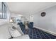 Comfortable living room with seating and view into kitchen and dining area at 191 Maison Dr. # B203, Myrtle Beach, SC 29572