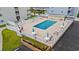 Aerial view of the community pool area with lounge chairs and patio tables at 191 Maison Dr. # B203, Myrtle Beach, SC 29572