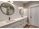 Bathroom with double vanity, modern fixtures and shiplap accent wall at 217 Shady Pines Ct., Conway, SC 29527