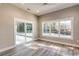 Well-lit bedroom with large windows and sliding glass doors that lead to outdoor area at 217 Shady Pines Ct., Conway, SC 29527