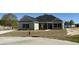 Charming single-story home showcasing stone accents, black shutters, and a well-manicured lawn at 217 Shady Pines Ct., Conway, SC 29527