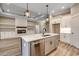 Well-designed kitchen with an island and stainless steel dishwasher providing convenience at 217 Shady Pines Ct., Conway, SC 29527