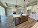 Open floorplan featuring a kitchen island with stainless steel appliances and light countertops at 217 Shady Pines Ct., Conway, SC 29527