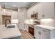 Stylish kitchen features stainless steel appliances, subway tile backsplash, and quartz countertops at 217 Shady Pines Ct., Conway, SC 29527