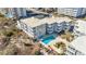 Aerial view showcasing a condo building, pool, and beach access at 2405 S Ocean Blvd. # 306, North Myrtle Beach, SC 29582