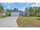 Charming single-Gathering home featuring a stone facade, a two-car garage and a well-manicured lawn at 2515 Saint Andrews Dr., Little River, SC 29566