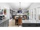 Dining area seamlessly connects to the kitchen, featuring stylish décor, contemporary lighting, and ample seating for gatherings at 6205 Nixon St., North Myrtle Beach, SC 29582