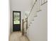 Bright entryway featuring a wooden staircase and black front door at 866 Foxtail Dr. # C-34, Longs, SC 29568