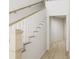 Light and bright hallway with wooden staircase and white trim at 866 Foxtail Dr. # C-34, Longs, SC 29568