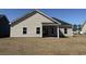 A charming home featuring a spacious backyard and a covered patio, perfect for outdoor gatherings at 1009 Jase Dr., Longs, SC 29568