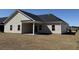 A charming home featuring a spacious backyard and a covered patio, perfect for outdoor gatherings at 1009 Jase Dr., Longs, SC 29568