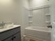 Bathroom featuring a gray vanity with double sinks and a shower/tub combo at 1009 Jase Dr., Longs, SC 29568