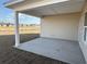 A spacious covered patio, perfect for enjoying the outdoors in comfort, and overlooking the backyard at 1009 Jase Dr., Longs, SC 29568