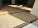 Close-up of new laminate flooring being installed in a sunlit room at 1009 Jase Dr., Longs, SC 29568