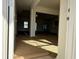 View from entry showcasing the spacious living area with natural light and neutral paint at 1009 Jase Dr., Longs, SC 29568