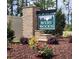 Avery Woods community sign with brick base, black awning, and floral landscaping at 1009 Jase Dr., Longs, SC 29568