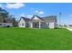 Spacious backyard featuring green grass and patio for outdoor enjoyment at 1101 Anne St., North Myrtle Beach, SC 29582