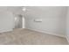 Bright bedroom featuring neutral carpet, white walls, and access to the bathroom at 1101 Anne St., North Myrtle Beach, SC 29582