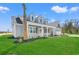 Beautiful home with a green lawn and palm tree in the front yard at 1101 Anne St., North Myrtle Beach, SC 29582