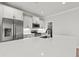 Modern kitchen featuring stainless steel appliances, white cabinetry, and a quartz countertop island at 1101 Anne St., North Myrtle Beach, SC 29582