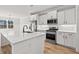 Modern kitchen featuring stainless steel appliances, white cabinetry, and large island at 1101 Anne St., North Myrtle Beach, SC 29582
