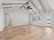 Bright living room featuring vaulted ceilings, exposed beams, and new hardwood floors at 1101 Anne St., North Myrtle Beach, SC 29582
