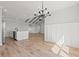 Open living space with hardwood floors, wainscoting, and modern lighting at 1101 Anne St., North Myrtle Beach, SC 29582