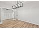 Open room with luxury vinyl plank flooring and an ornate chandelier at 1101 Anne St., North Myrtle Beach, SC 29582