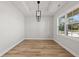 Bright room featuring luxury vinyl plank flooring and modern lighting at 1101 Anne St., North Myrtle Beach, SC 29582