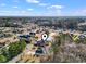 Aerial view of home and neighborhood, featuring a nearby pond and wooded areas at 305 Duel Ct., Myrtle Beach, SC 29588