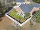 Overhead view of fenced backyard patio area with seating and trees at 305 Duel Ct., Myrtle Beach, SC 29588