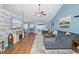 Spacious living room with vaulted ceilings, stylish decor, wood-look floors, and plenty of natural light at 305 Duel Ct., Myrtle Beach, SC 29588