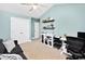 Comfortable office space with shelving, natural light, and practical furniture for productivity at 305 Duel Ct., Myrtle Beach, SC 29588