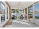 Relaxing screened porch with ceiling fan and comfortable patio furniture at 305 Duel Ct., Myrtle Beach, SC 29588