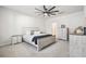 Bright main bedroom features a ceiling fan, carpet, and coordinating furniture at 62 S Reindeer Rd., Surfside Beach, SC 29575