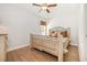 Bright bedroom with a ceiling fan, wood floors, and neutral decor at 76 Eagle Pass Dr., Murrells Inlet, SC 29576