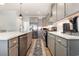 The kitchen features stainless appliances, pendant lighting, and a decorative backsplash at 76 Eagle Pass Dr., Murrells Inlet, SC 29576