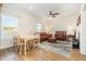 Comfortable living room with a ceiling fan, leather furniture, and a dining area at 76 Eagle Pass Dr., Murrells Inlet, SC 29576