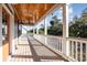 Relax on this inviting porch, featuring a wood ceiling, fan, and serene outdoor views at 76 Eagle Pass Dr., Murrells Inlet, SC 29576