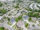 An aerial view of a neighborhood showcasing homes with well-manicured lawns and mature trees at 1201 Surf Pointe Dr., North Myrtle Beach, SC 29582