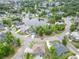An aerial view captures the neighborhood, complete with lush landscaping and a central pond at 1201 Surf Pointe Dr., North Myrtle Beach, SC 29582