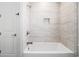 This tiled tub and shower include a built-in niche for convenience and a modern look at 1201 Surf Pointe Dr., North Myrtle Beach, SC 29582