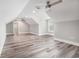 This large bonus room has wood-look flooring, neutral walls, and dormer windows at 1201 Surf Pointe Dr., North Myrtle Beach, SC 29582