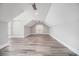 This bonus room has wood-look flooring, neutral walls, and a ceiling fan at 1201 Surf Pointe Dr., North Myrtle Beach, SC 29582