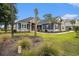 Beautiful home showcasing its manicured lawn, stone accents, symmetrical design, and curb appeal at 1201 Surf Pointe Dr., North Myrtle Beach, SC 29582