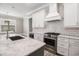 Modern kitchen featuring stainless steel appliances, white subway tile backsplash, and marble countertop island at 1201 Surf Pointe Dr., North Myrtle Beach, SC 29582