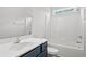 Bathroom with white tub, vanity, and toilet at 197 Six Mile Creek Dr., Georgetown, SC 29440