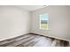 Bright bedroom with wood-look floors and large window at 197 Six Mile Creek Dr., Georgetown, SC 29440