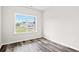 Bright bedroom with wood-look floors and large window at 197 Six Mile Creek Dr., Georgetown, SC 29440