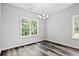 Bright dining room with hardwood floors and a chandelier at 197 Six Mile Creek Dr., Georgetown, SC 29440